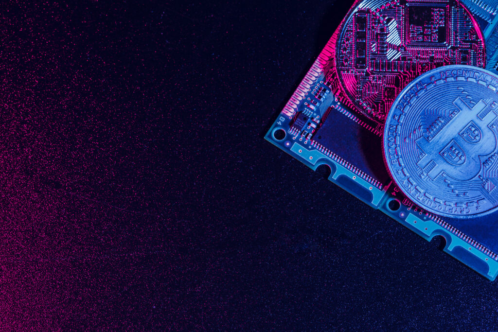 golden bitcoin and computer chip in background